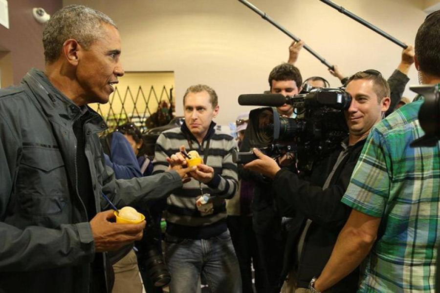 President Barack Obama hands ice cream to Josh Lederman